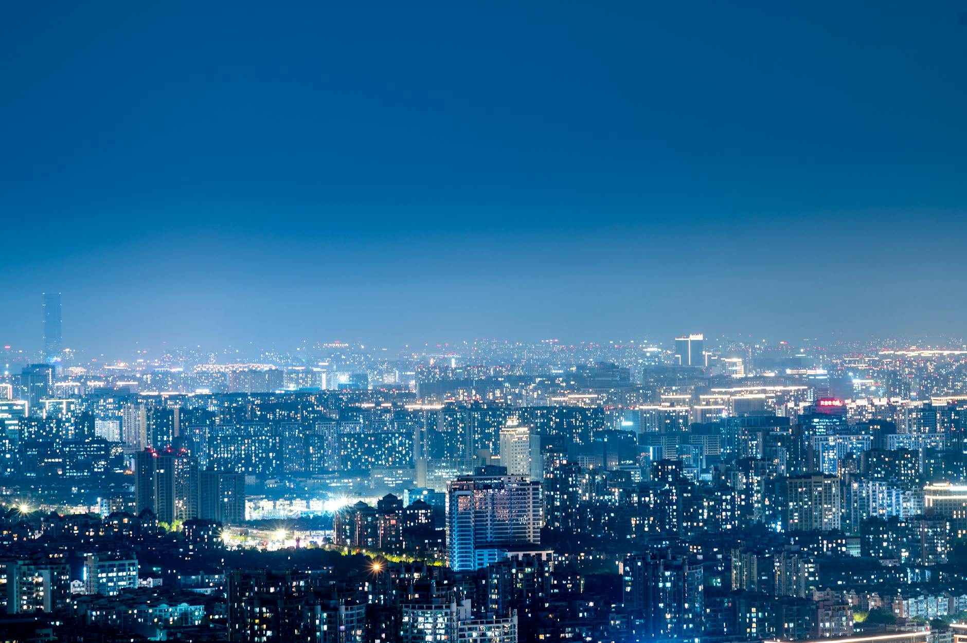 vibrant night skyline of modern cityscape
